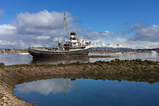Ship wrec near Ushuaia, Tierra del Fuego. Boats line the harbor