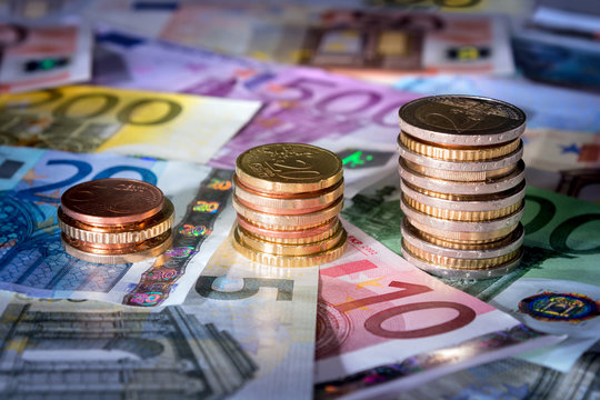 coins chart on euro banknotes￼￼