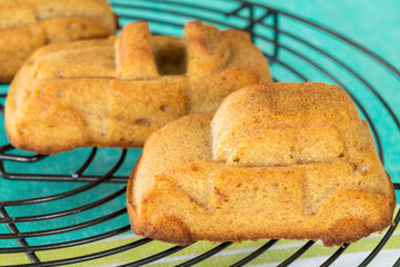 Homemade muffin in the shape of cars on cooling rack