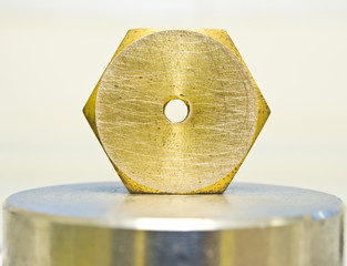 hexagonal nut made of brass