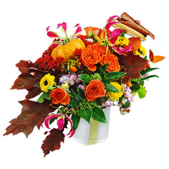 Autumn arrangement of flowers, vegetables and fruits isolated on