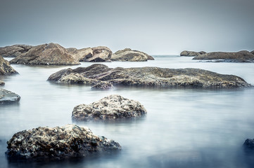 Pebble rocks on beach die Oysterl ,Long exposure technic .