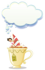 A girl above the big mug of tea