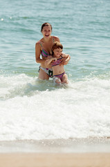  mother with daughter in sea