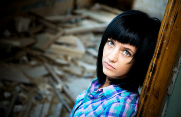 Girl in a destroyed building