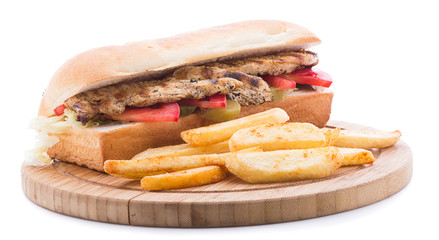 Grilled chicken sandwich with french fries isolated on white