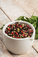 Mixed pepper on wooden background