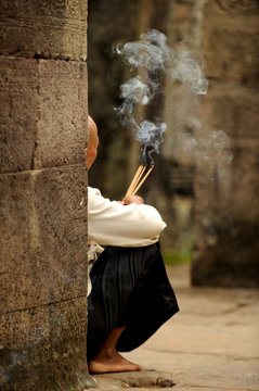 Buddhist Nun Praying In The Temple Of Angkor