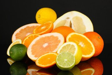 Lots ripe citrus isolated on black