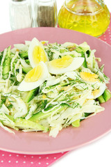 Delicious salad with eggs, cabbage and cucumbers
