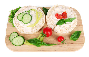 Tasty crispbreads with vegetables, isolated on white