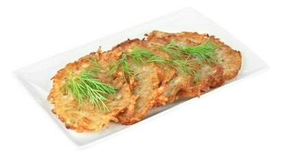 Potato pancakes on plate, isolated on white