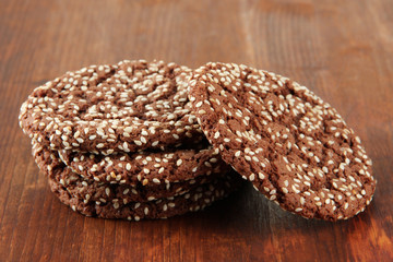 Homemade cookies with sesame seeds, on wooden background
