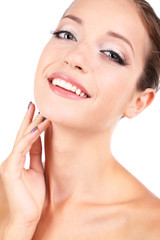 Fototapeta premium Beautiful girl with glowing skin close-up isolated on white