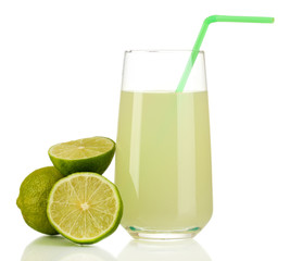 Delicious lemon juice in glass and limes next to it isolated