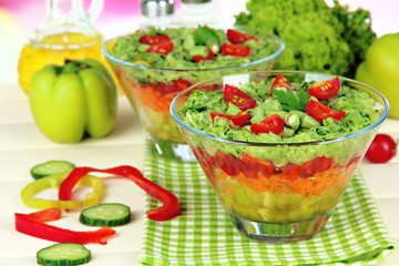 Tasty salad with fresh vegetables on wooden table