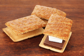 Sweet sandwiches on wooden background