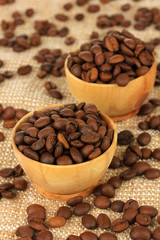 Coffee beans in bowls on table close-up