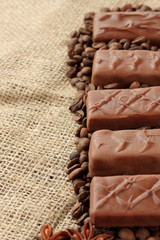 Delicious chocolate bars with coffee beans