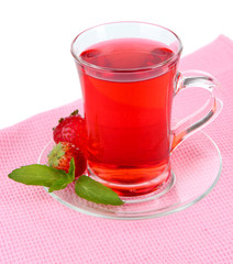 Delicious strawberry tea on table on white background