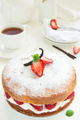 Cake with cream and strawberries.