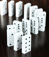 Dominoes on wooden background
