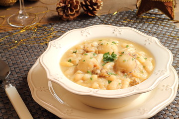 Cuttlefish and white beans stew on a Christmas table