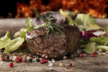 Grilled steaks on wood