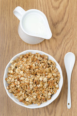homemade muesli and a jug of milk for breakfast top view