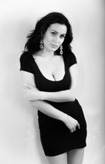 Fototapeta premium Sexy girl in classical short black dress