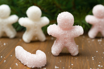 Fototapeta na wymiar Multi-colored sugar in the form of little people
