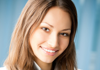 Cheerful female doctor at office