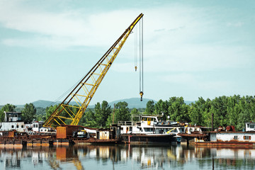Damaged industrial boats at the bay