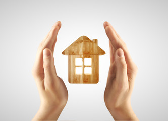 hands holding home
