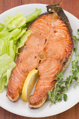 salmon with salad on the plate