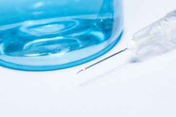 medical ampoules and syringe isolated on white background