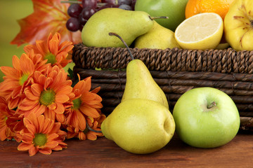 Different fruits with basket and flowers