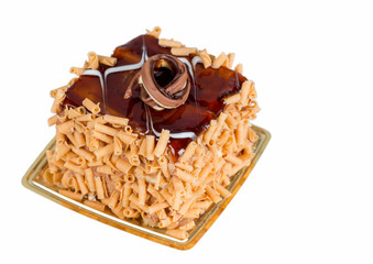 Delicious cake with caramel on top isolated