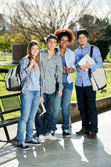 Fototapeta premium Confident Students Standing In Campus