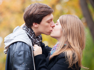 couple kissing at outdoor in the park