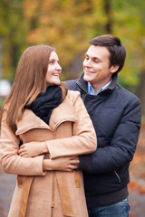 Teen couple in the autumn park