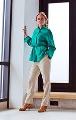 young beautiful woman in green jacket