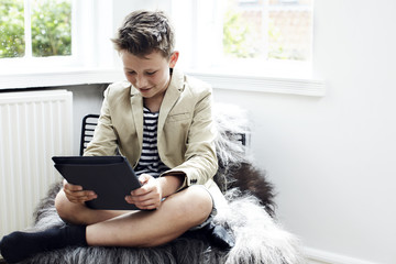 Teenage boy using a digital tablet