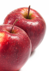 Several red apples on white background