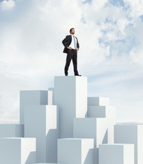 man standing on highest cube