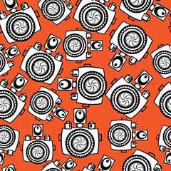 cameras on red background seamless pattern