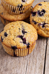 Healthy blueberry banana muffins on a wooden table