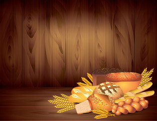 Breads and wheat on dark wooden background vector © La Gorda