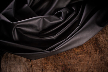Black satin fabric close-up