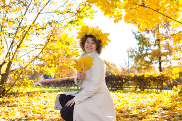 Middle-aged woman in the autumn park